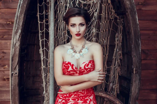 Brunette woman in red dress — Stock Photo, Image