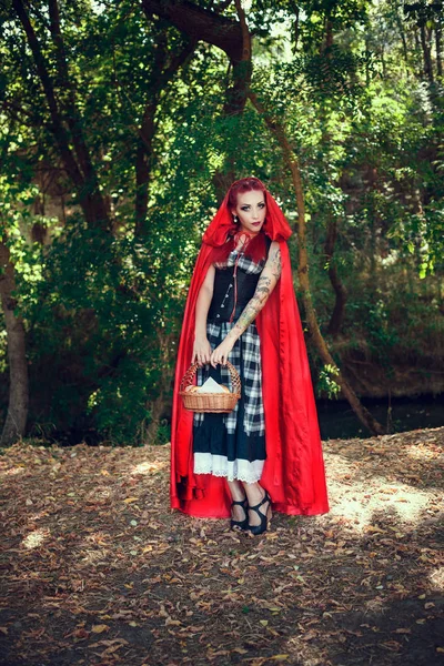 Woman in red cape — Stock Photo, Image