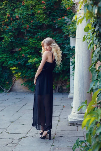 Blonde woman in black dress — Stock Photo, Image