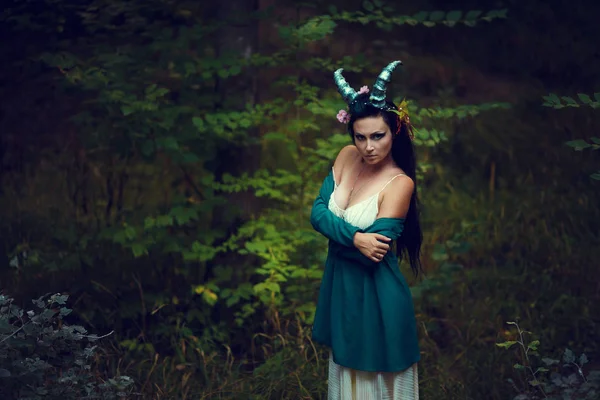 Woman with wreath and horns — Stock Photo, Image