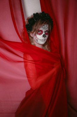 beautiful woman with custom designed candy skull mexican day of the dead