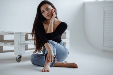 portrait of mixed race Asian Caucasian female in studio.