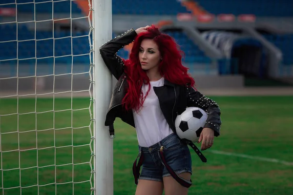 Sexy fitness woman or cheerleader with a soccer ball — 스톡 사진