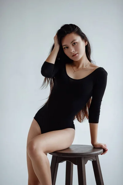 Portrait of mixed race Asian Caucasian female in studio. — Stockfoto