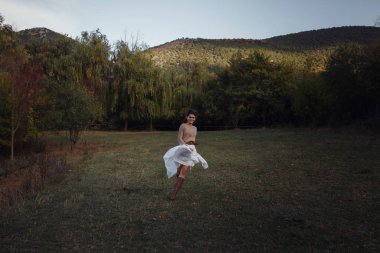Girl resting in the village, portrait of a woman in rustic style.
