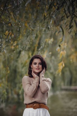 Girl resting in the village, portrait of a woman in rustic style.