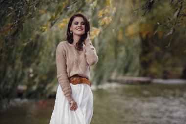 Girl resting in the village, portrait of a woman in rustic style.