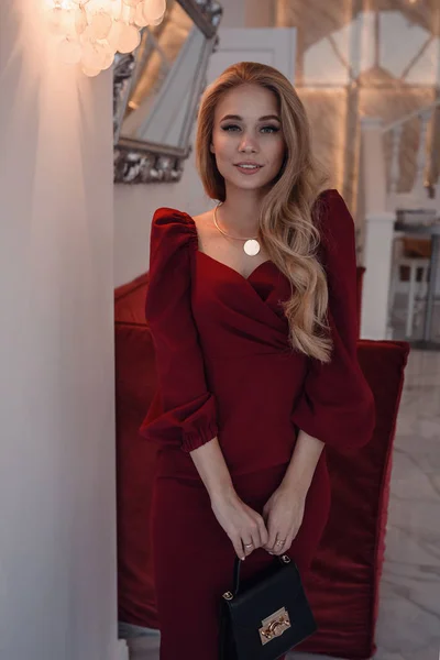 Romantic portrait of elegand blond woman waiting for someone in a luxury restaurant — Stock Photo, Image