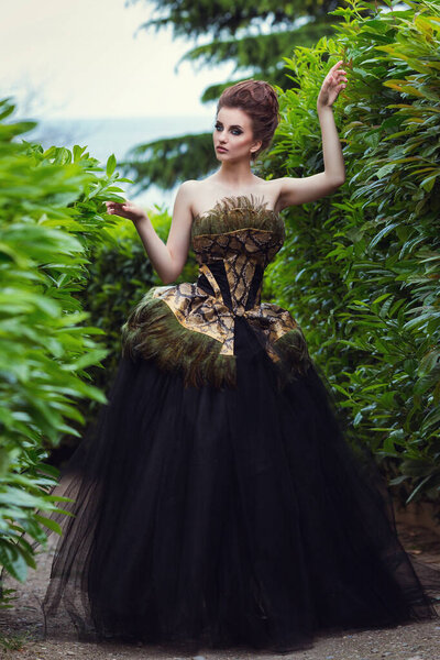 Gorgeous Woman in Evening retro dress Posing near old palace. Vorontsov Palace. Crimea