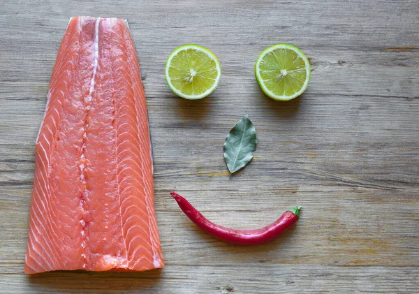 Fresh raw salmon fillet on a wooden background. Top view, selective focus. — 스톡 사진