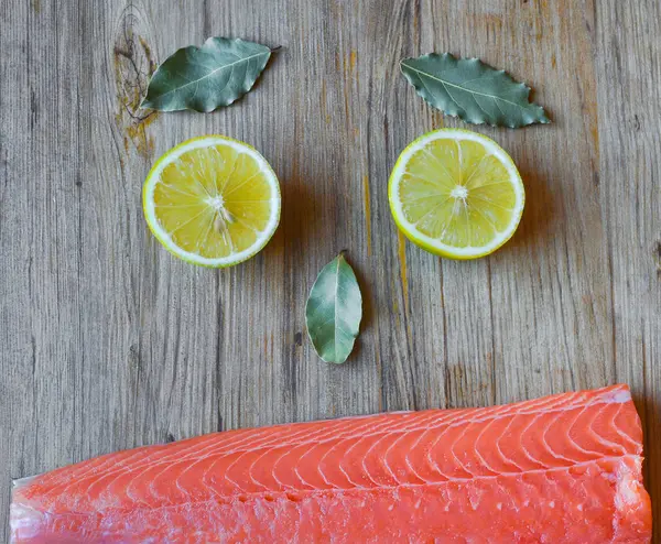 Fresh raw salmon fillet on a wooden background. Top view, selective focus. — 스톡 사진