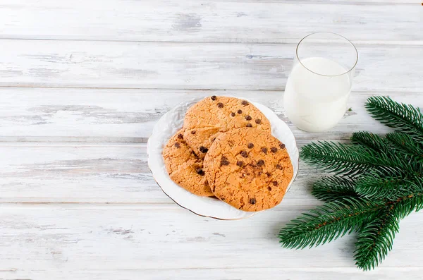 Glass of milk and cookies with chocolate for Santa — Stock Photo, Image