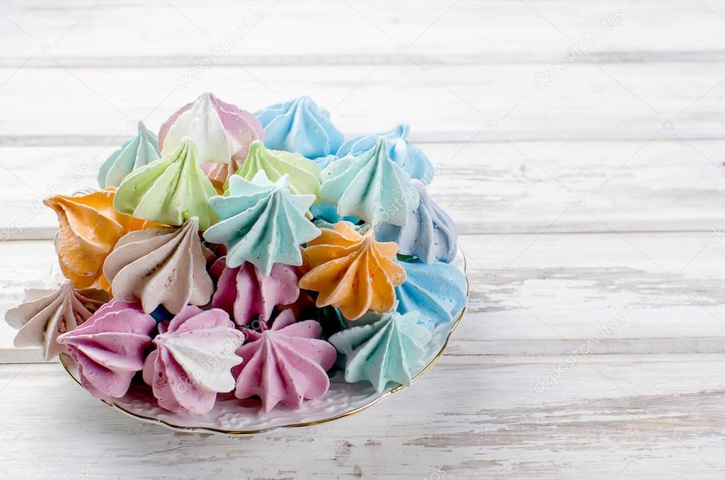 colored meringue on a plate closeup