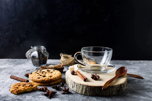 Emply Cup for  tea, biscuits, cinnamon, anise on dark   backgrou — Stock Photo, Image