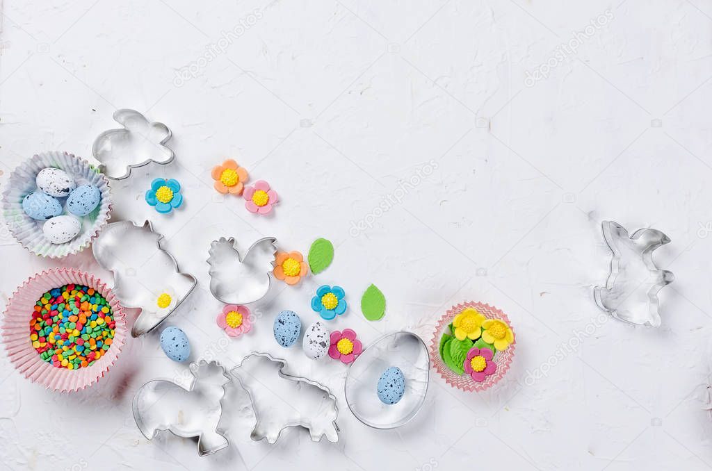 Easter background with cookie cutter and sugar sprinkles