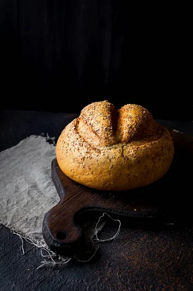 Bread loaf on black background