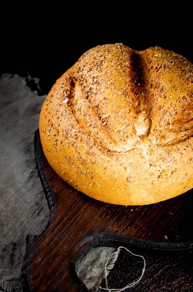 Bread loaf on black background