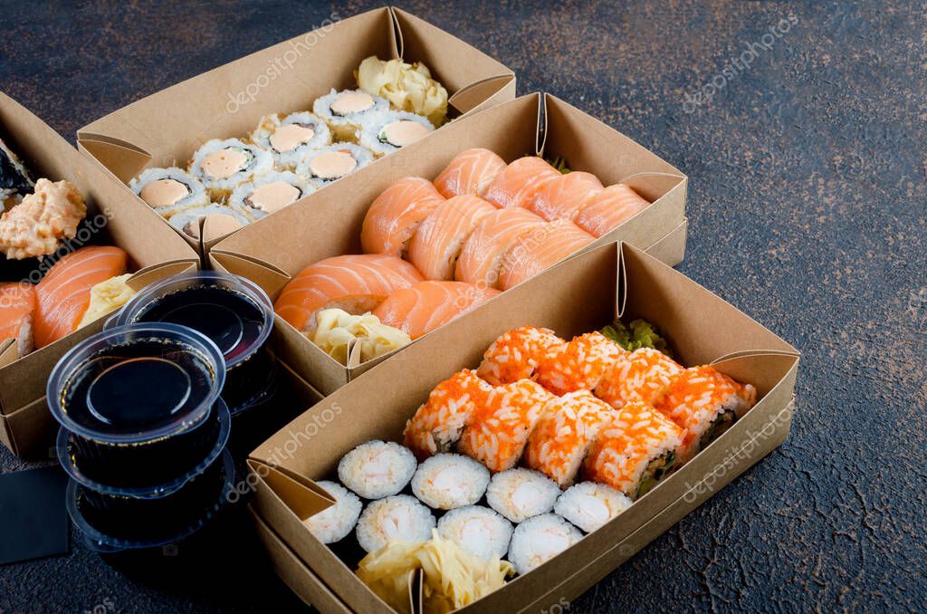 Download Tasty Sushi Rolls In Disposable Kraft Paper Boxes Sauces On Dark Table Concept Delivery Service Japan Food In Eco Container Flat Lay Template Mockup With Place For Text Zero Waste Packaging