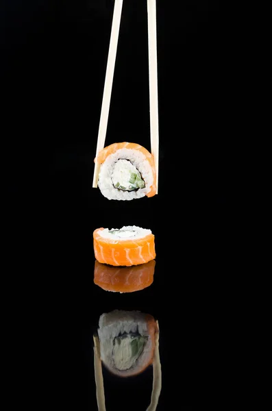 Chopsticks Taking Sushi Philadelphia Salmon Black Background Asian Restaurant Menu — Stock Photo, Image
