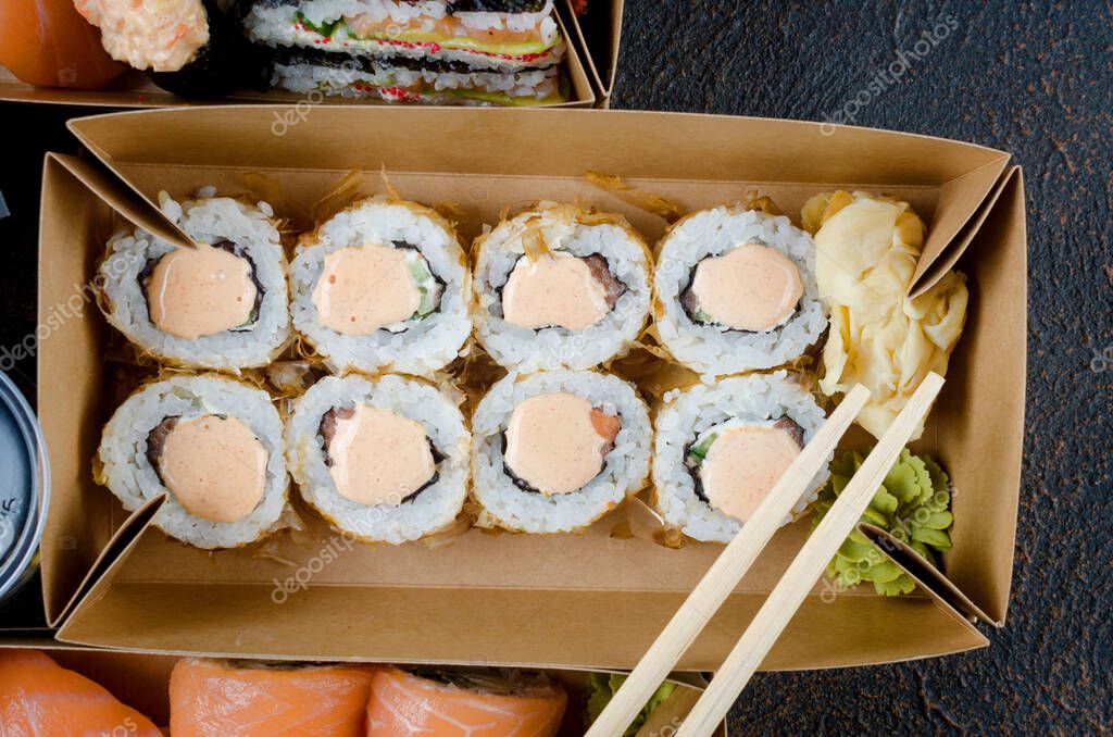Download Tasty Sushi Rolls In Disposable Kraft Paper Boxes Sauces On Dark Table Concept Delivery Service Japan Food In Eco Container Flat Lay Template Mockup With Place For Text Zero Waste Packaging 376940562