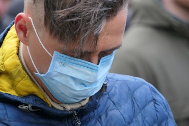 Kiev, Ukraine - March, 16, 2020: ordinary citizens are protected with a mask.