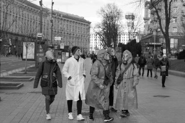 Kiev, Ukraine - March, 15, 2020: young guys in protective clothing.