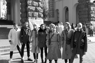 Kiev, Ukraine - March, 14, 2020: a group of people in protective suits who are afraid of a terrible disease.