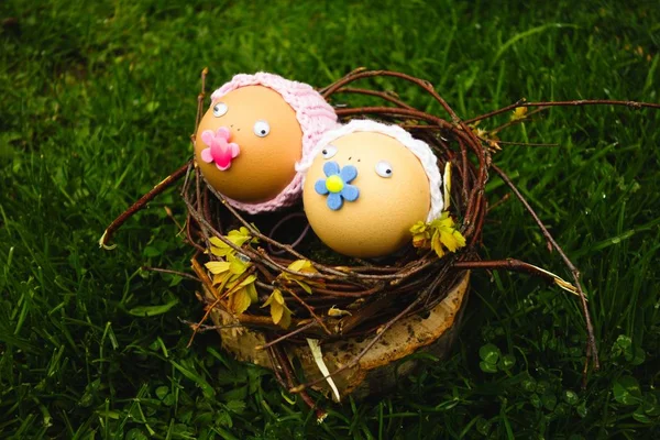 Easter eggs - babies in a nest. Funny and beautiful handmade creative decoration for Easter holidays.