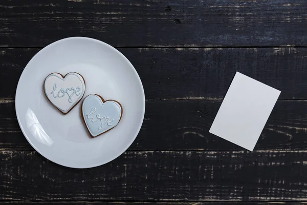 Heart Shape Gingerbread Cookie White Plate Standing Black Wooden Table — Stock Photo, Image