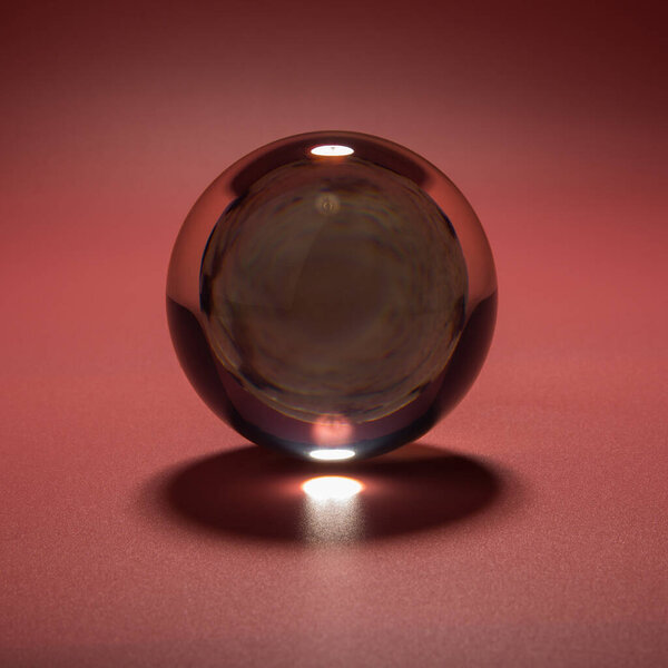 seashell in a glass ball on a pink background