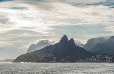 Snenic view of Morro dois Irmaos (Two Brother Mountain) and part of Ipanema beach in a loud sunset, Rio de Janeiro, Brazil.