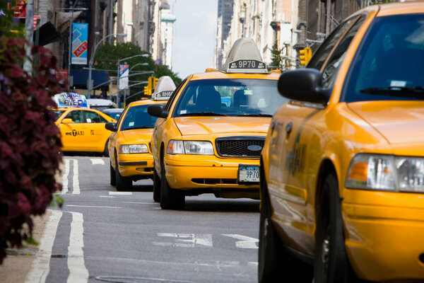 MANHATTAN, NY - November 7, 2011: Yellow cabs in the streets of Manhattan near the new york times building.