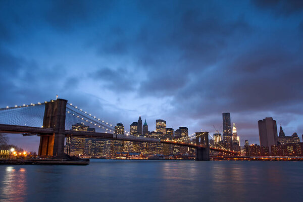 MANHATTAN, NY- May 9, 2009: The famous Brooklyn Bridge in New York City at dawn.