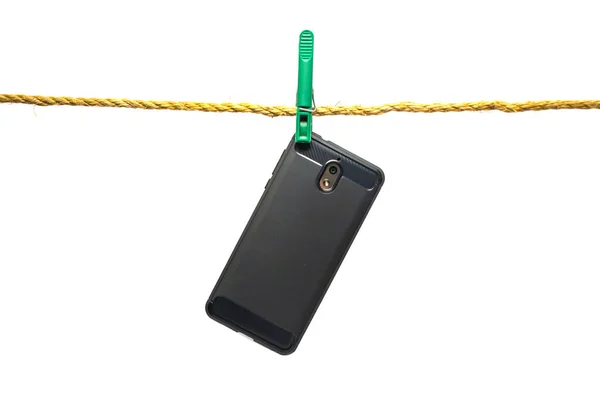 Téléphone Pèse Sur Une Corde Attachée Avec Une Pince Linge — Photo