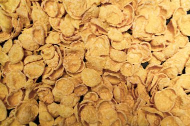 Sarı mısır gevreği geçmişi, sağlıklı yaşam tarzı, siyah bir arka plan.