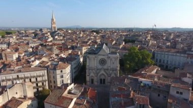 aerial flight towards saint roch church early morning in montpellier france ecusson down town center