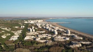 aerial view of la grande motte resort seaside town with camping marina city park along the mediterranean sea sunset time drone view