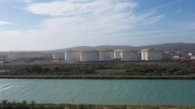 canal and oil storage facilities frontignan france aerial drone shot sunset