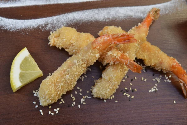 shrimp fried in breadcrumbs. deep fried shrimp meat ball on wooden table.