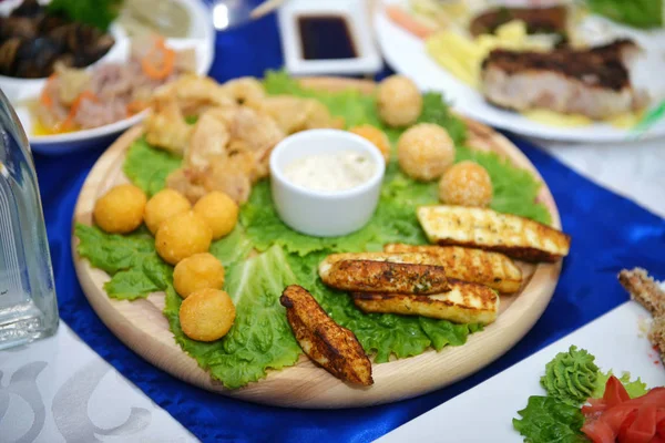 Different appetizer and anti pasti. Fresh tasty seafood served on table. Top view. Close-up. — Stock Photo, Image