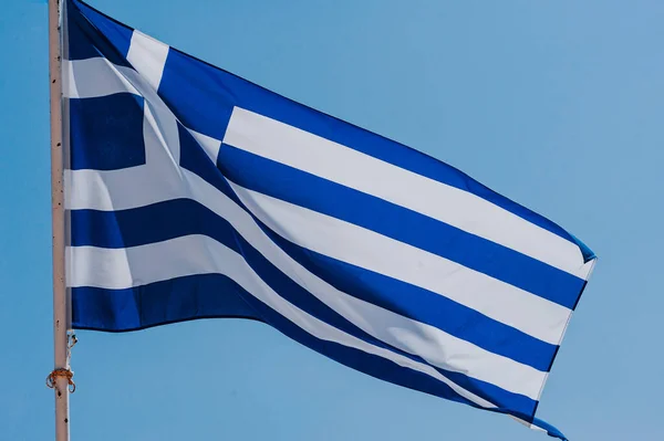 Greek Flag on the Blue Sky background