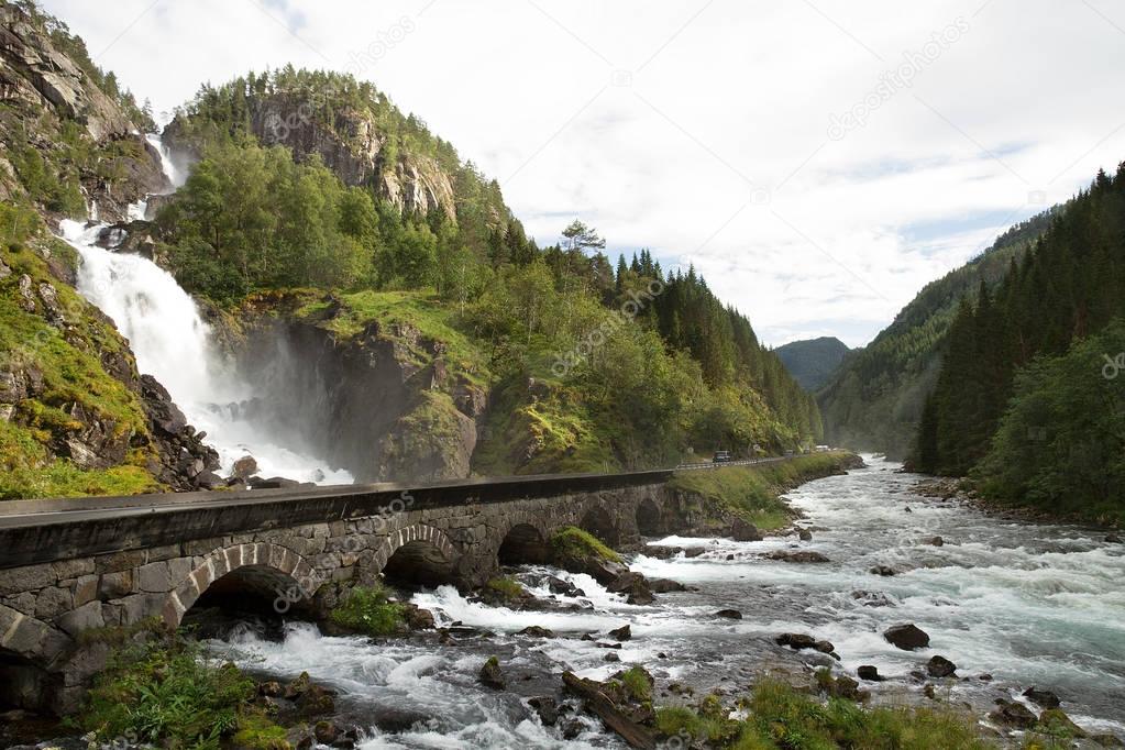 Waterfall, river and bridge in Norway