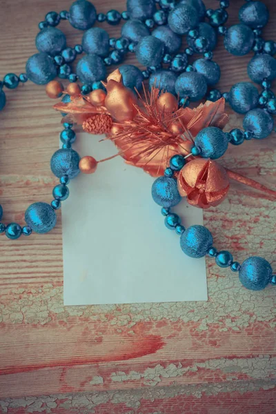 Blue beaded necklace and paper card — Stock Photo, Image