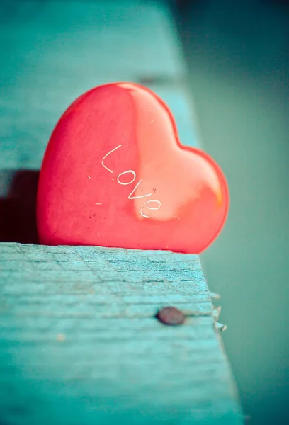 Red heart on wooden table — Stock Photo, Image