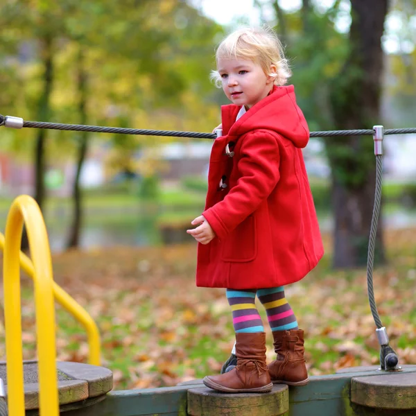 Active little girl playing at the playground — Stock Photo, Image