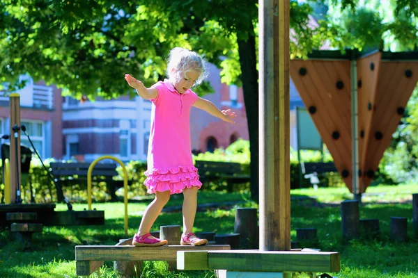 Cute kid playing in the park — Stock Photo, Image