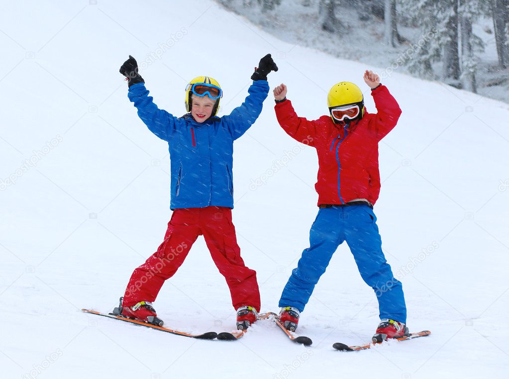 Active children enjoying winter ski holidays