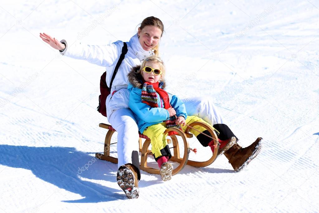 Mother and child enjoying winter holidays