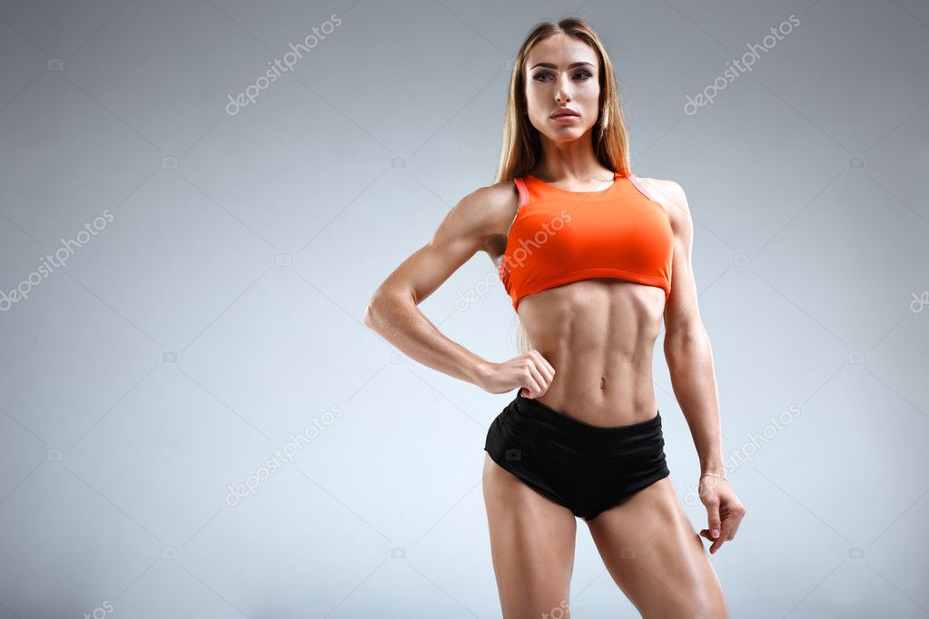 Slim female fitness model in the white studio Stock Photo by ©greentogipi  127098554