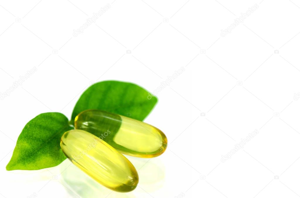 Yellow soft gelatin capsule in natural products concept.